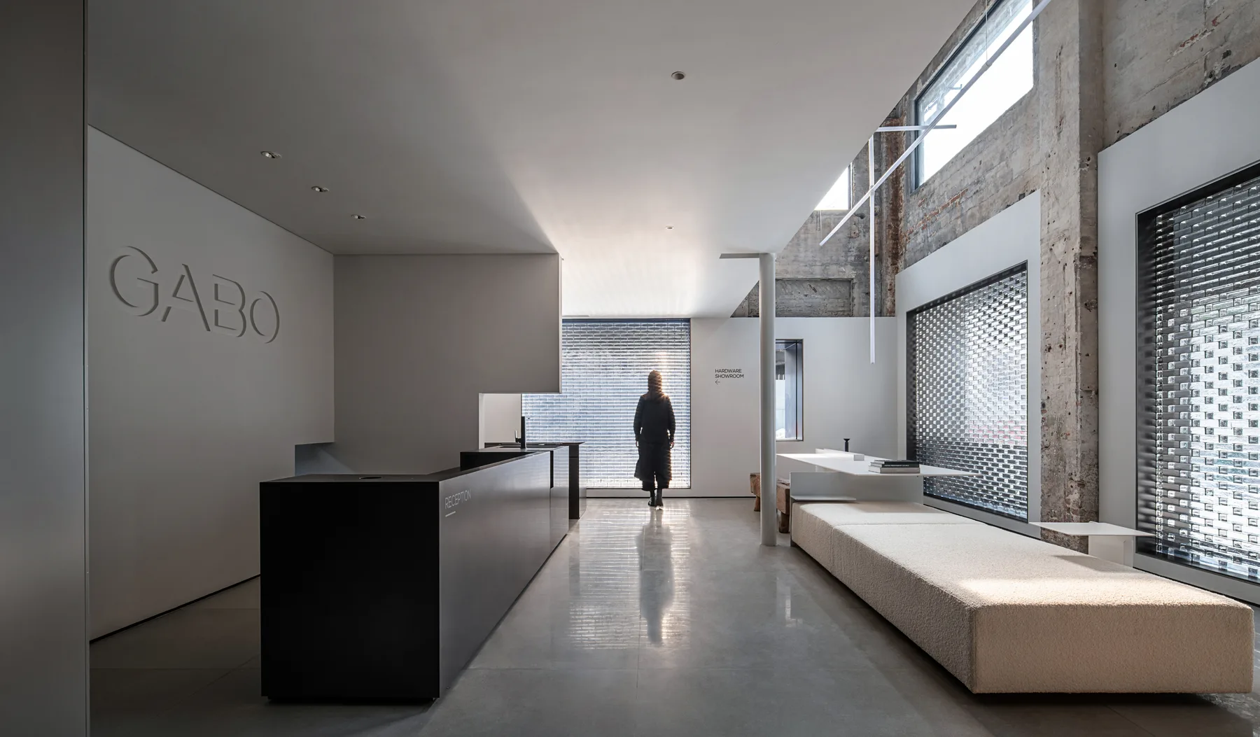 GABO showroom interior with architectural light and refined material rhythm
